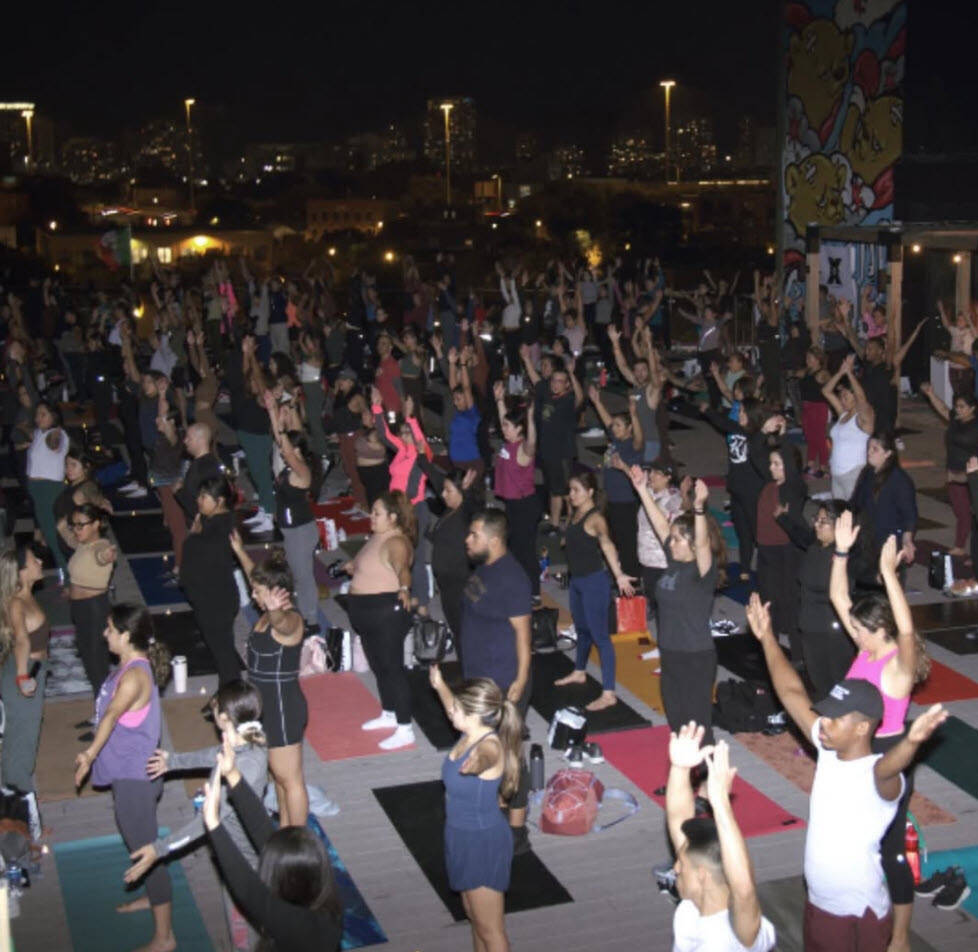 A group of runners stretching, representing the Venados Running Club collaboration