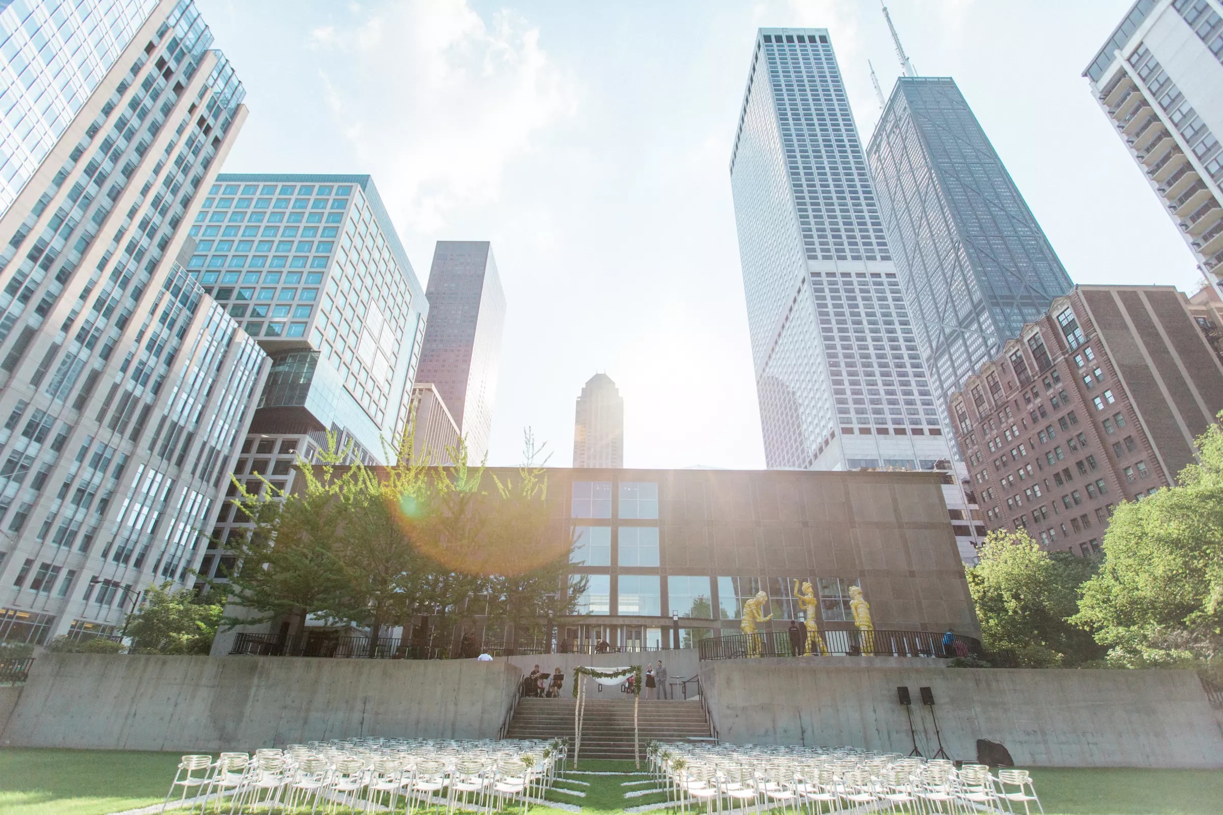 MCA Chicago exterior courtyard set for an outdoor event beneath downtown high-rises