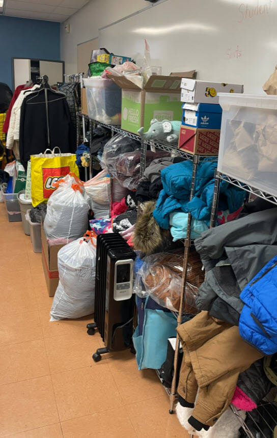 A table full of donated clothing items