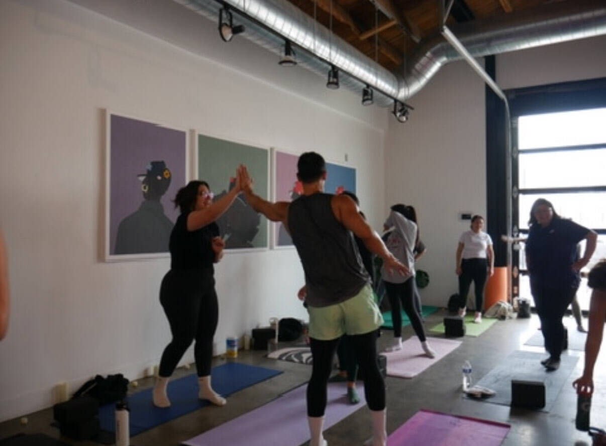 Diverse group of people in a yoga teacher training session